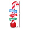 Inflatable candy cane signpost for Christmas directions.