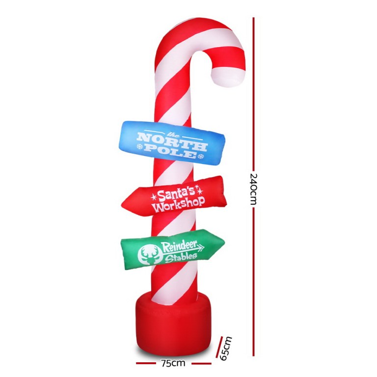 Inflatable candy cane signpost for Christmas directions.