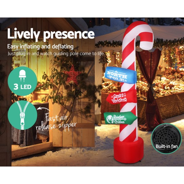 Inflatable candy cane with LED lights and signs.