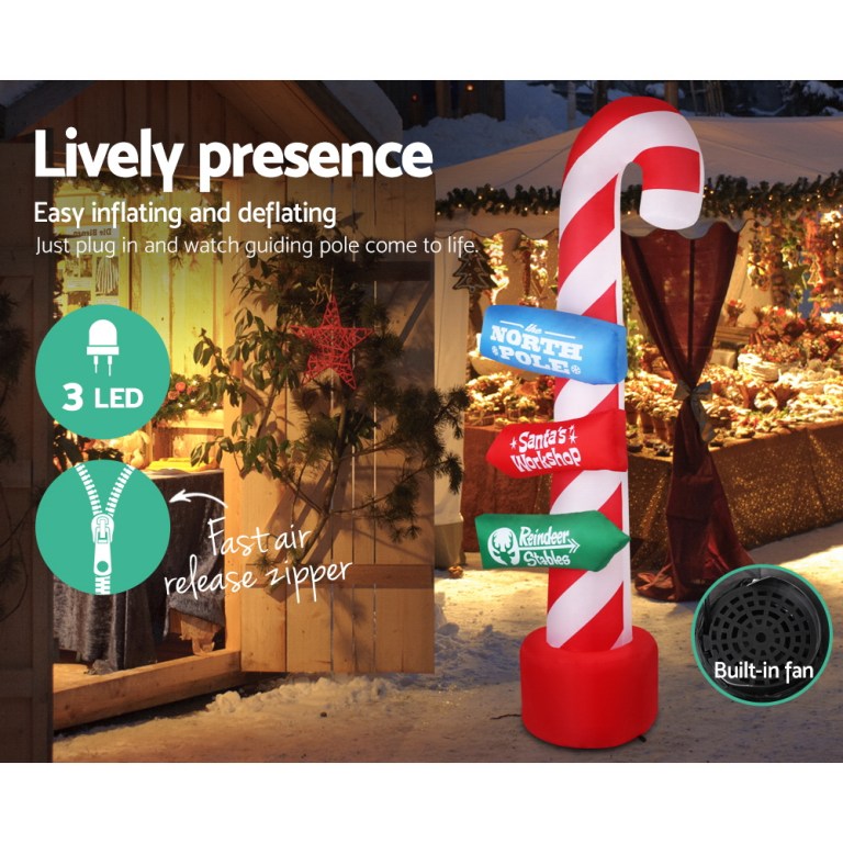 Inflatable candy cane with LED lights and signs.
