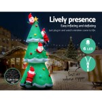 Inflatable Christmas tree with Santa and LED lights.