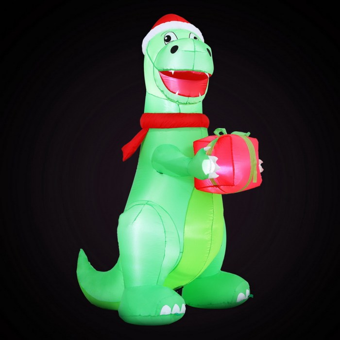 Inflatable Christmas dinosaur holding a wrapped present.