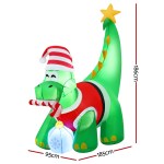 Inflatable Christmas dinosaur decoration with lights and candy cane.