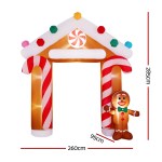Inflatable gingerbread archway with candy cane columns.