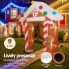 jingle jollys christmas inflatable archwary ginger 2.8m illuminated decorations Inflatable gingerbread arch with Christmas lights at night.