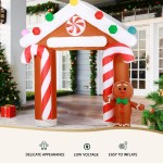Inflatable gingerbread house with candy canes, Christmas decor.