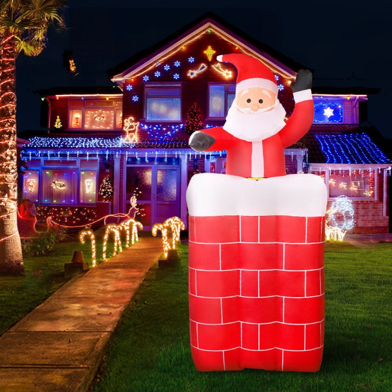 jingle jollys christmas inflatable santa pop up 1.8m illuminated decorations Inflatable Santa in chimney, festive house lights.