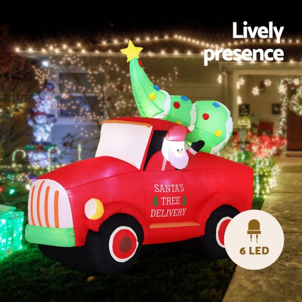 Inflatable Santa's tree delivery truck with lights.