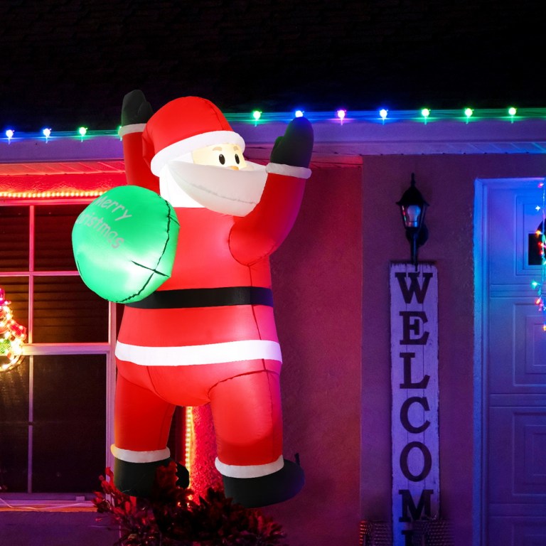 Inflatable Santa decoration with Christmas lights.