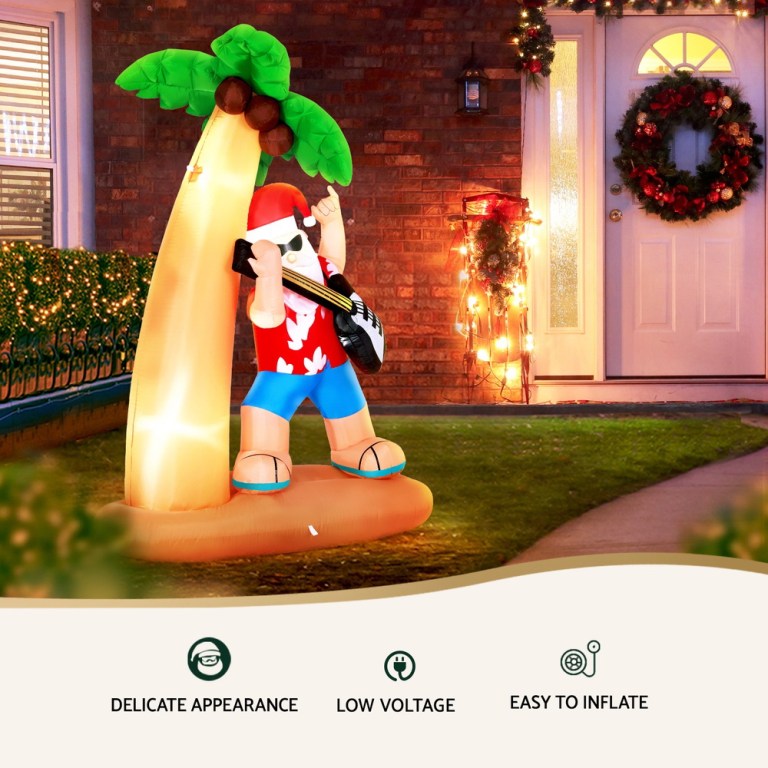 jingle jollys christmas inflatable santa guitar 2.1m led illuminated decorations Inflatable Santa with guitar and palm tree decoration.