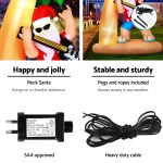 jingle jollys christmas inflatable santa guitar 2.1m led illuminated decorations Inflatable Santa with lights, sturdy base, and accessories.