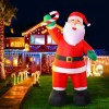 jingle jollys christmas inflatable santa 3m illuminated decorations Inflatable Santa in front of festive house lights