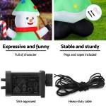 Inflatable Christmas snowman with pegs, rope, and adapter.
