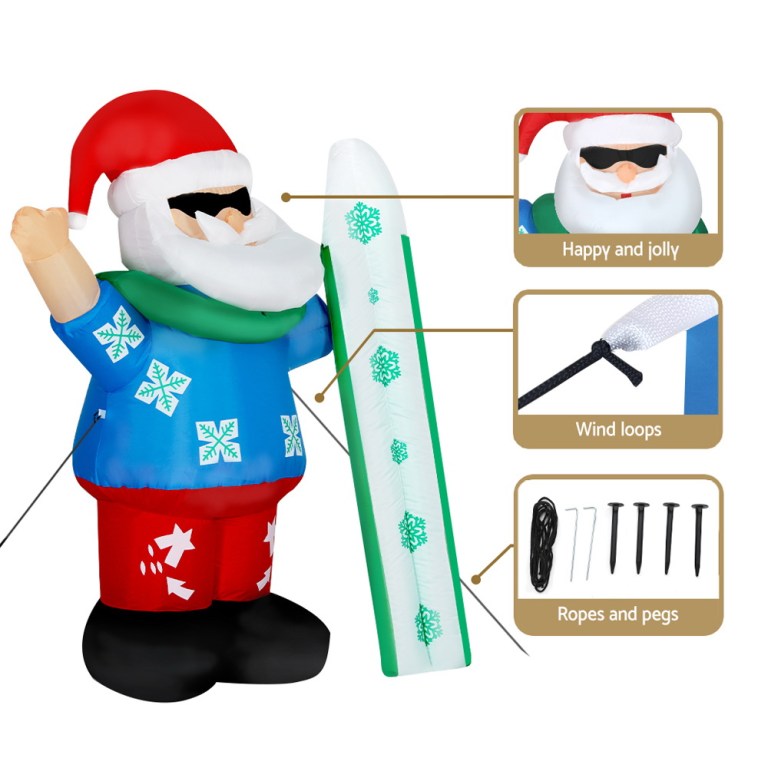 Inflatable Santa with surfboard, wind loops, ropes, pegs.