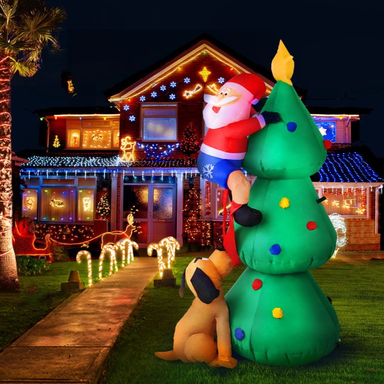 Festive Christmas lights and inflatable Santa decoration.