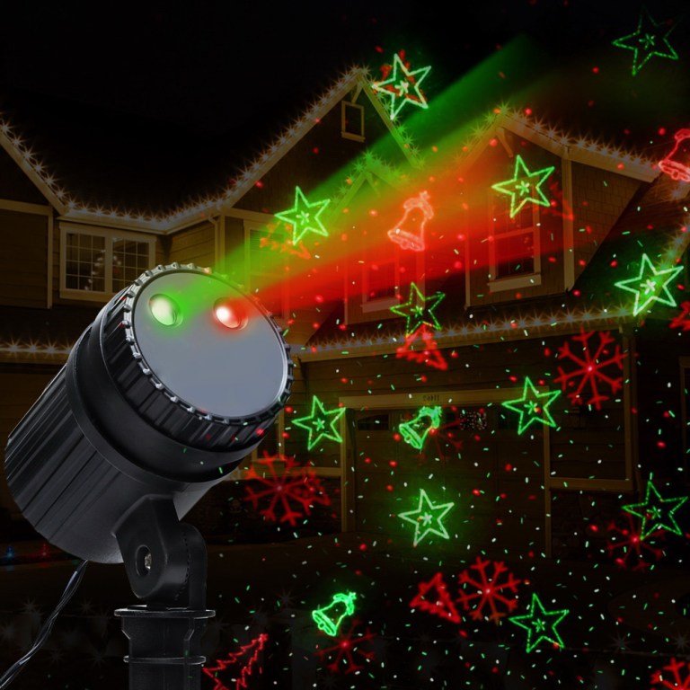 Christmas laser projector lights on house facade.