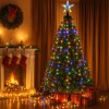 Decorated Christmas tree with lights and presents.