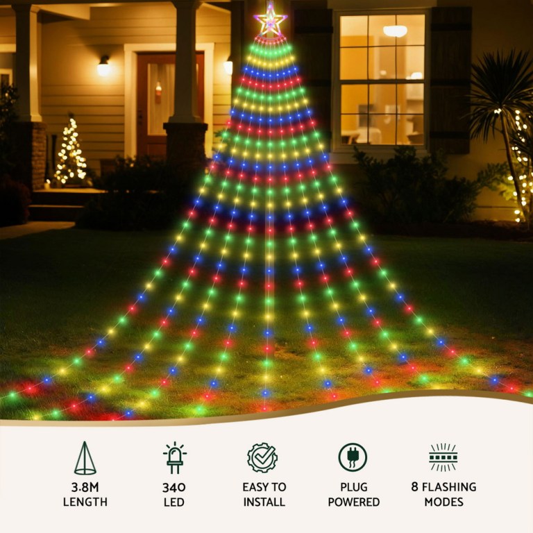 Colourful Christmas tree lights on house lawn.