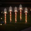 Solar candy cane Christmas lights in garden.