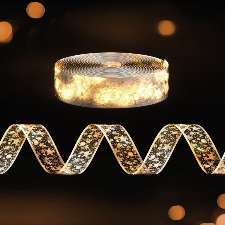 Sparkling LED Christmas ribbon on dark background.