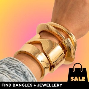 Gold bangles on wrist, jewellery sale offer.