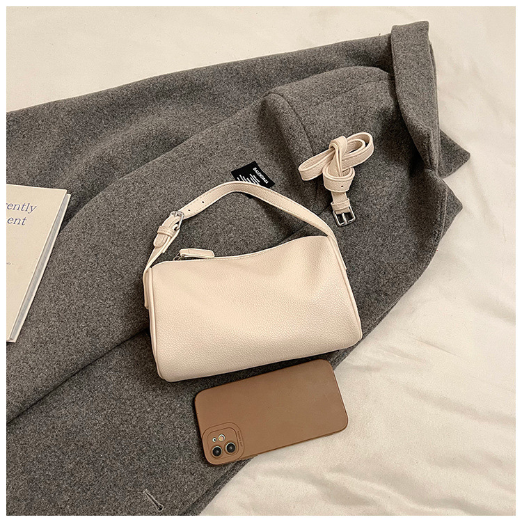 beige minimalist shoulder bag high end cylindrical design