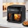 devanti air fryer 5.5l touch control electric cooker 1200w black Black air fryer cooking roast chicken in kitchen.