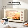 devanti 60l convection oven electric fryer ovens 2000w cream Beige electric oven with food inside on counter.