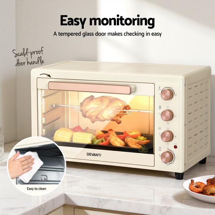 devanti 60l convection oven electric fryer ovens 2000w cream Beige electric oven with food inside on counter.
