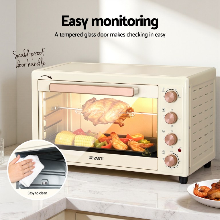 devanti 60l convection oven electric fryer ovens 2000w cream Beige electric oven with food inside on counter.