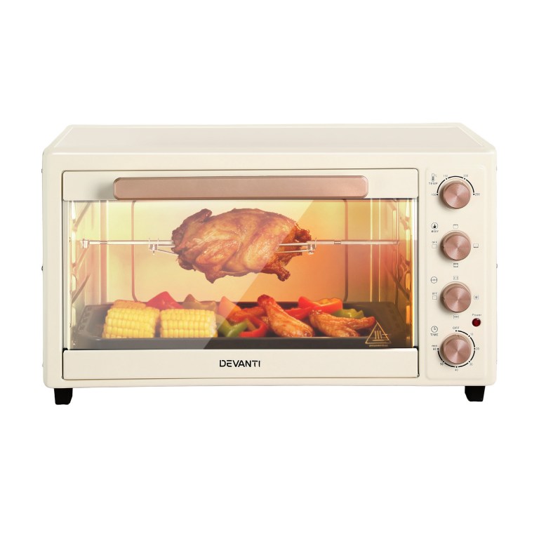 devanti 60l convection oven electric fryer ovens 2000w cream Modern oven with roasted chicken and vegetables.
