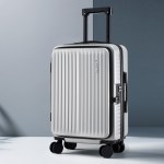 wanderlite 20 luggage suitcase front pocket travel carry on dual tsa silver" Silver hard-shell suitcase with four wheels and handle.