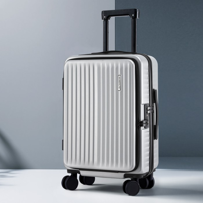 Silver hard-shell suitcase with four wheels and handle.