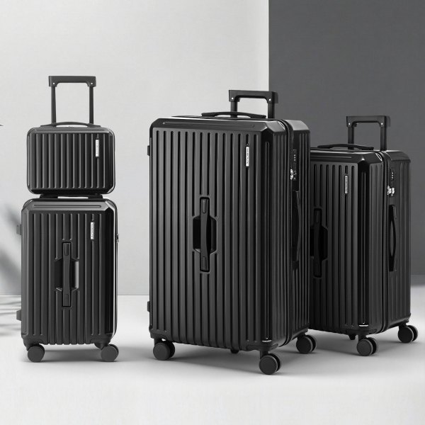 Four sleek black suitcases on display.