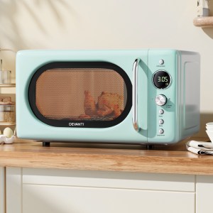 Retro green microwave with digital timer.
