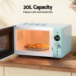 20L microwave with pizza inside on wooden counter.