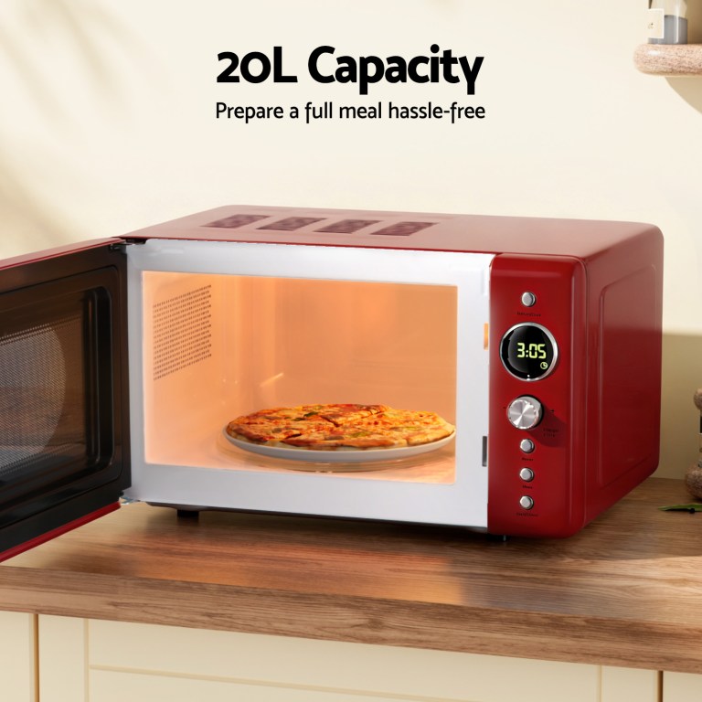 Red microwave oven with pizza inside, 20L capacity.
