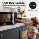 devanti 30l microwave oven 4 in 1 air fryer convection grill Child using microwave with child-lock feature.