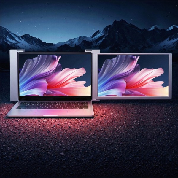 Laptop with dual screens and floral display.