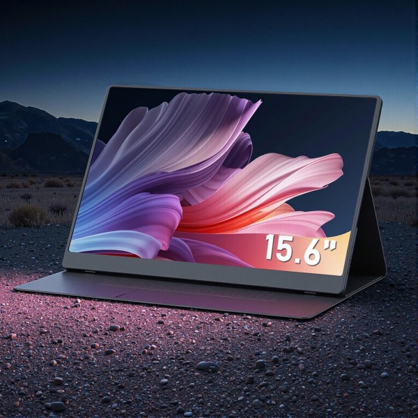 15.6-inch laptop on gravel at night