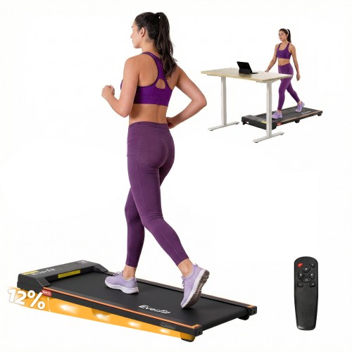 Woman walking on treadmill with remote control