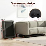 Treadmill stored under couch for space-saving.