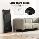everfit 3 in 1 walking pad treadmill 20% auto incline under desk treadmills for home gym with 40cm wide belt Foldable treadmill stored vertically beside a sofa.