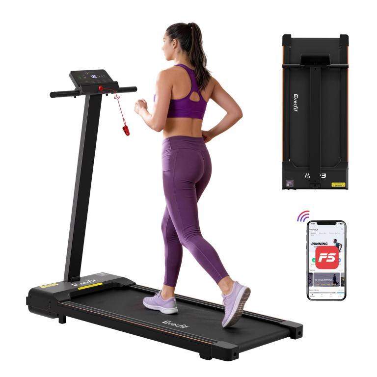 tmill 400 th bk 202602131618 00.jpg Woman jogging on foldable treadmill with app connectivity.