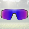 Purple-tinted wraparound sports sunglasses on grass.