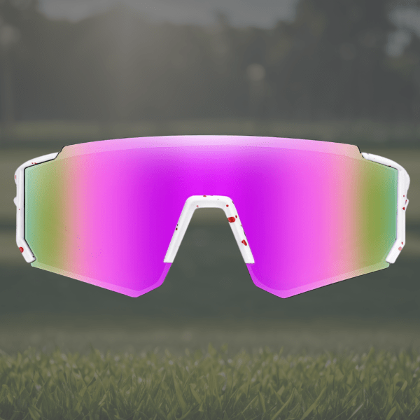 Colourful sports sunglasses on grassy field.