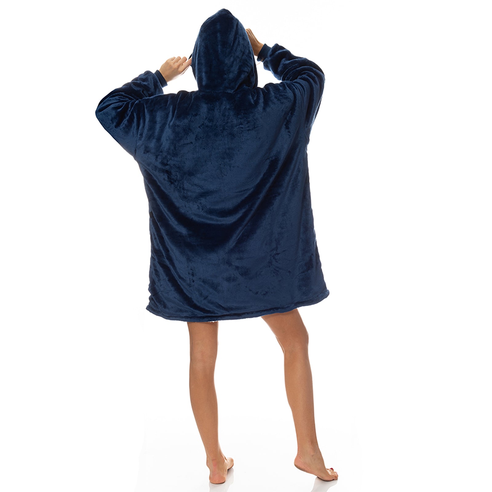 Person wearing oversized navy hoodie blanket, back view.
