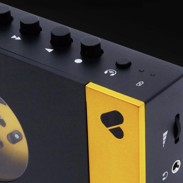 Black and yellow modern audio device with knobs.