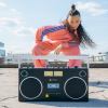 we are rewind getto blaster cassette player & recorder curtis, black Woman in pink tracksuit with boombox outdoors.