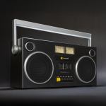 Retro boombox with dual speakers and cassette player.
